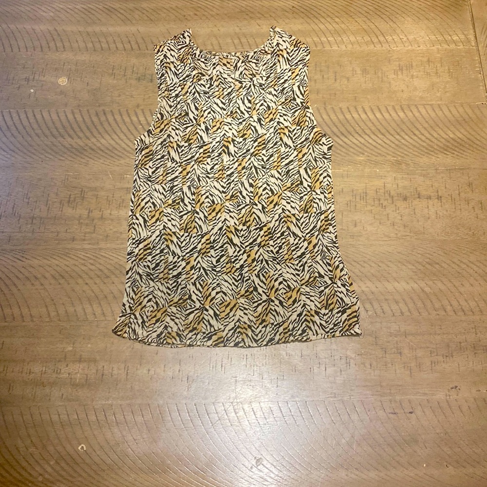 This is an animal print tank top made from notations clothing Co. 100% polyester